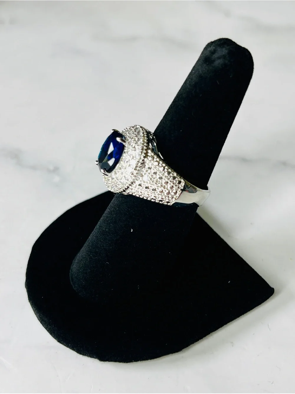 Elegant Silver Ring with Deep Blue Oval Center Stone